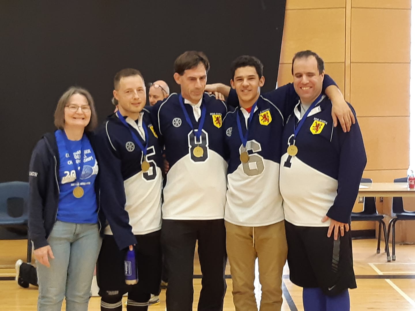 Gold Medal winning team, Nova Scotia 1 Linda MacRae Triff, Peter Parsons, Oliver Pye, Mason Smith, and John Courtney