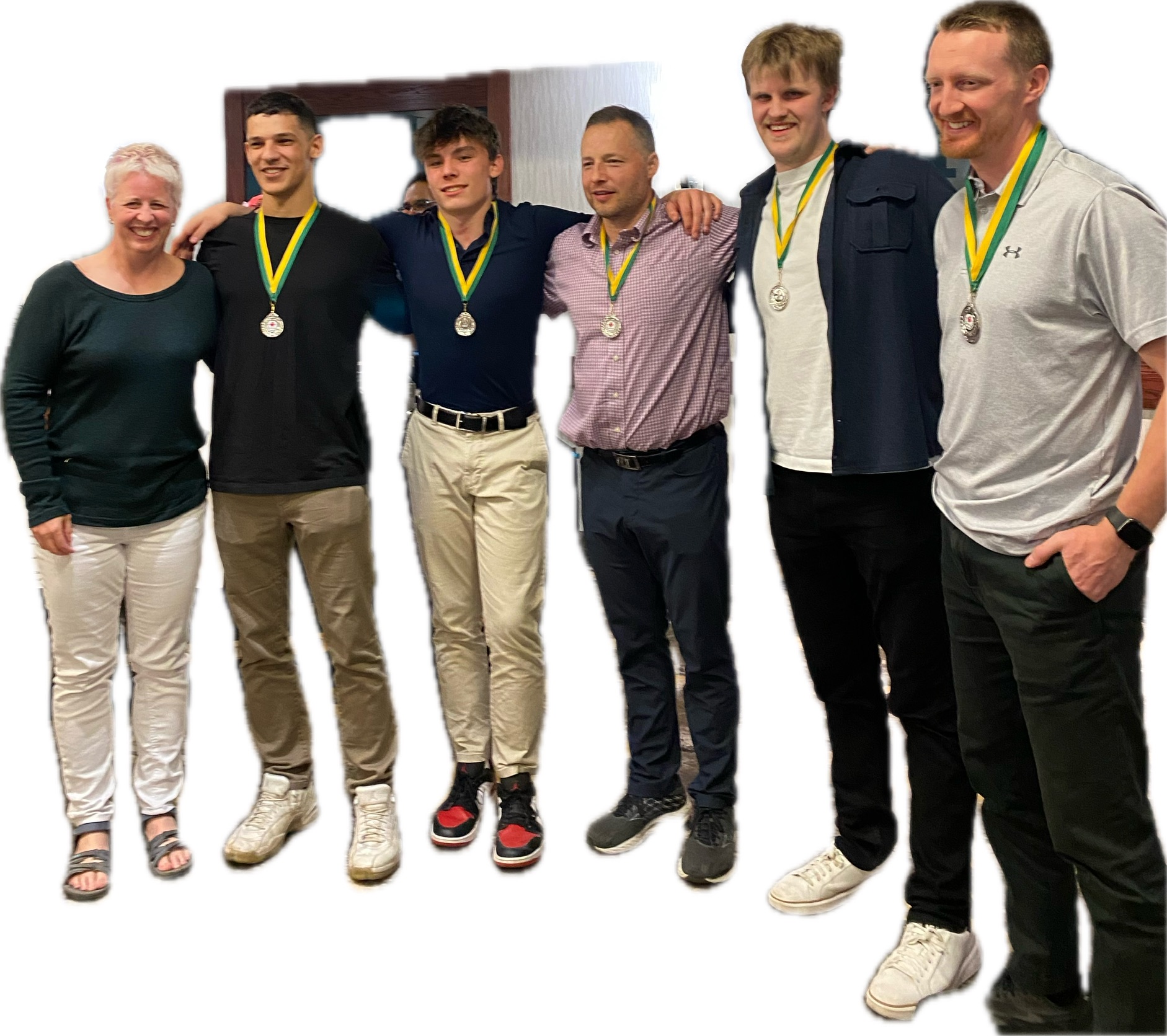 Six people standing shoulder to shoulder with arms around one another and wearing silver medals